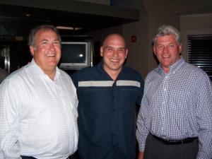 Michael Symon (center) with PGA of America CEO Joe Steranka (left) and President Jim Remy